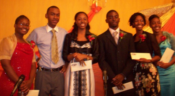 Scholarship winners display their envelopes