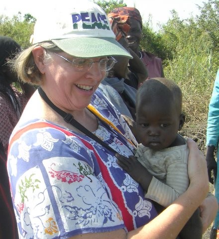 Pastor Nan in Nimule, S. Sudan in Feb. 2011. She always loves to hold the little ones.